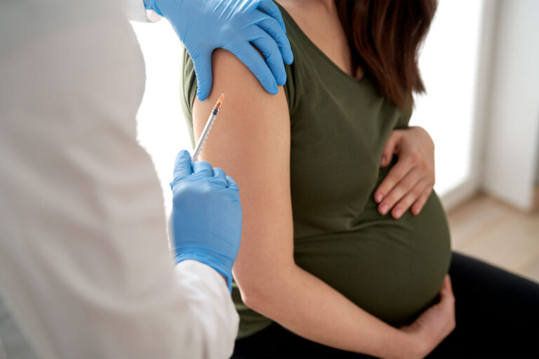 Pregnant woman getting vaccine